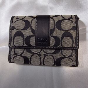 SOLD❤️ Coach signature canvas trifold wallet in black and tan with leather trim